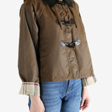 Brown jacket worn by a person, showing the jacket fit