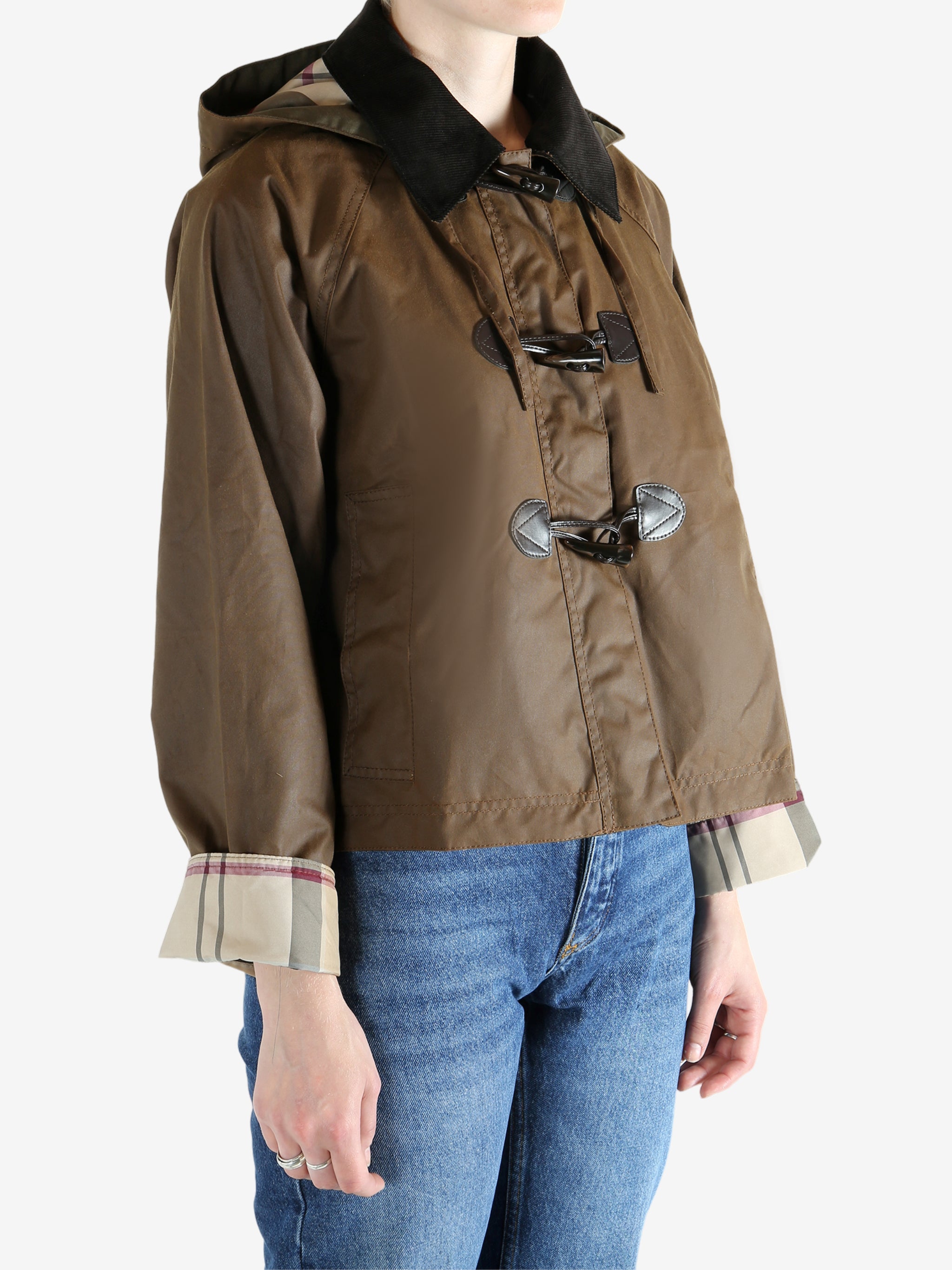 Brown jacket worn by a person, showing the jacket fit