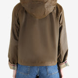 Brown jacket worn by a person, showing the jacket fit