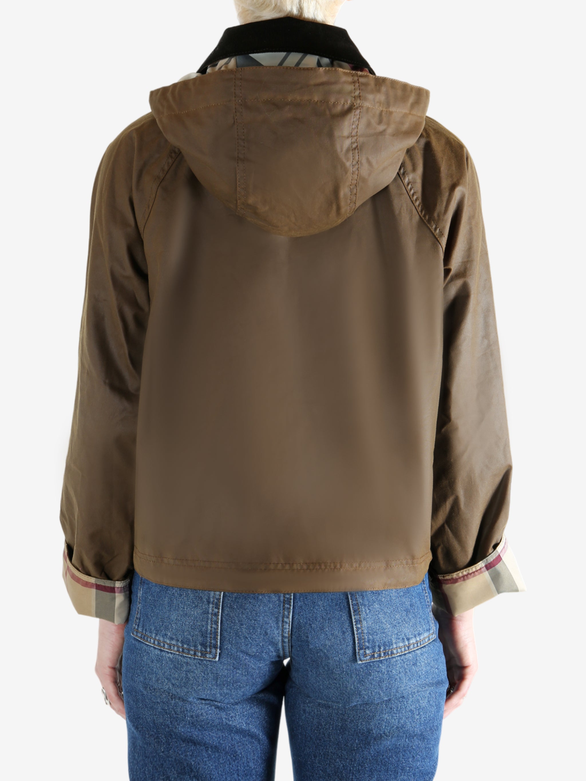 Brown jacket worn by a person, showing the jacket fit