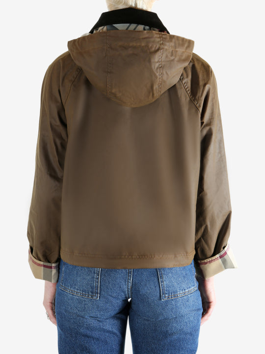 Brown jacket worn by a person, showing the jacket fit