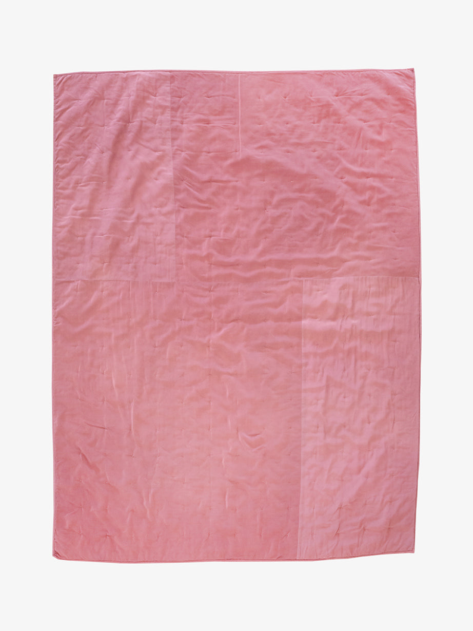 Back of hand-dyed dusty rose silk quilt by Lily Raskind, featuring smooth panel backing.