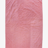 Back of hand-dyed dusty rose silk quilt by Lily Raskind, featuring smooth panel backing.