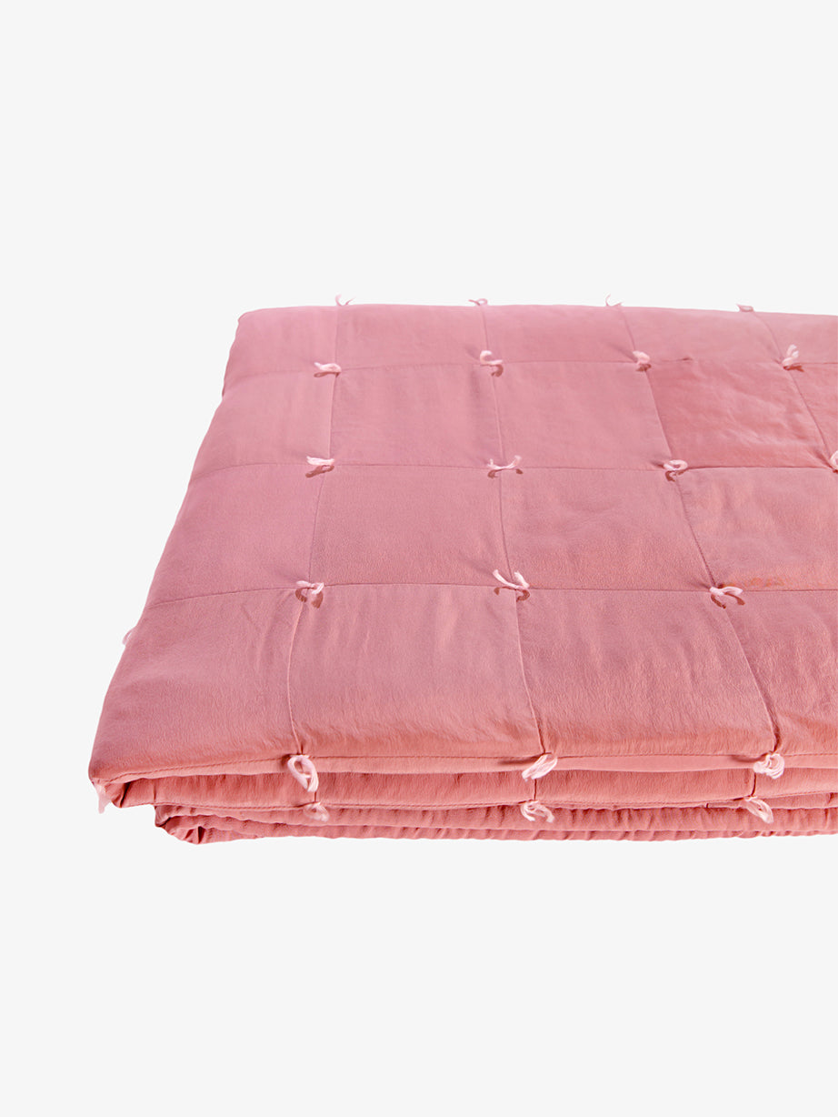 Write product listing alt text that is SEO + ADA focused that shows the thickness of the quilt folded