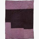 Back view of Lily Raskind hand-dyed silk blanket in Smoke Brush showing tonal patchwork layout in dark plum and mauve.