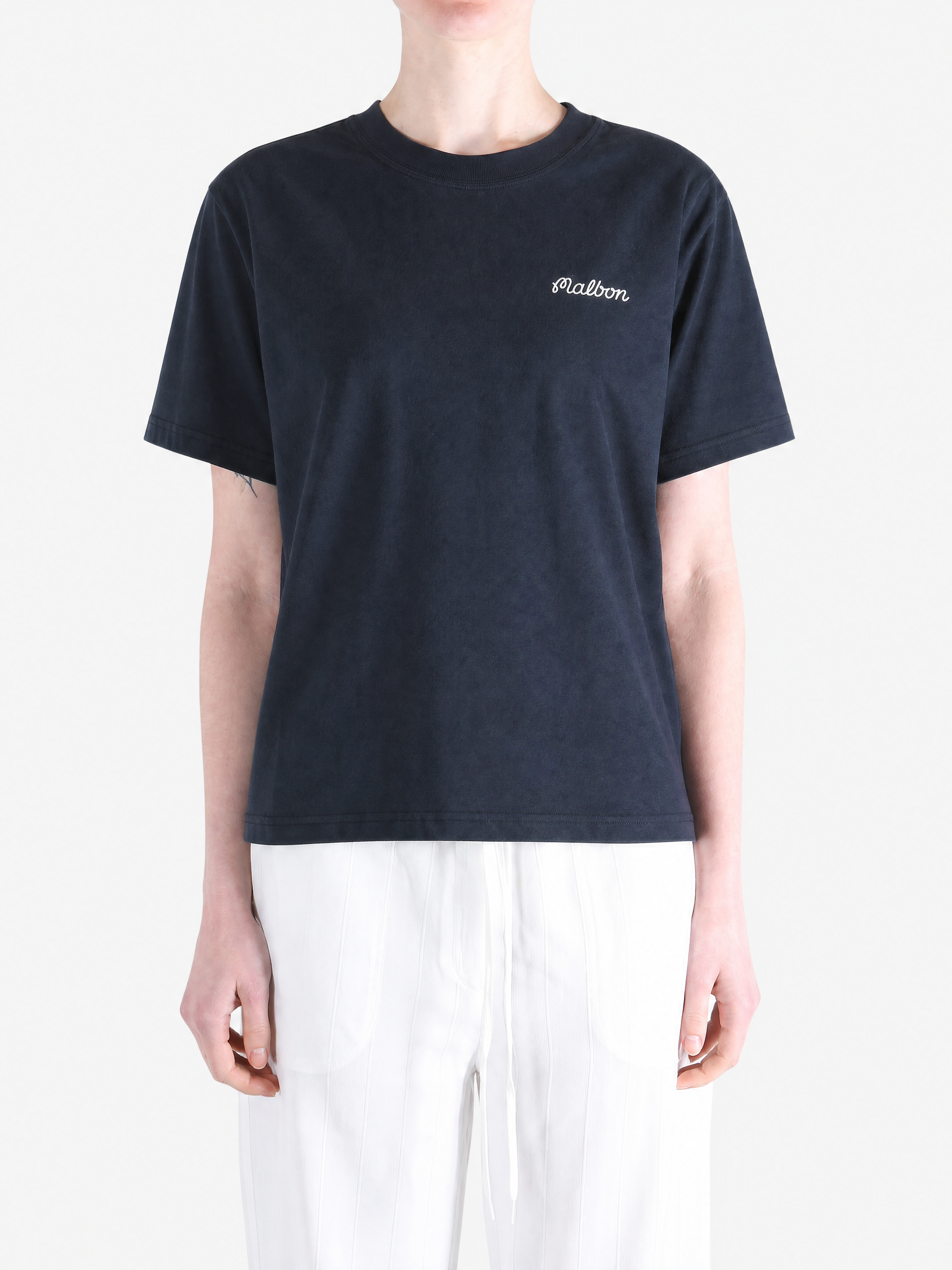 Navy t-shirt worn by a person, showing the t-shirt's fit.