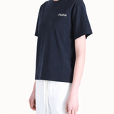 Navy t-shirt worn by a person, showing the t-shirt's fit.