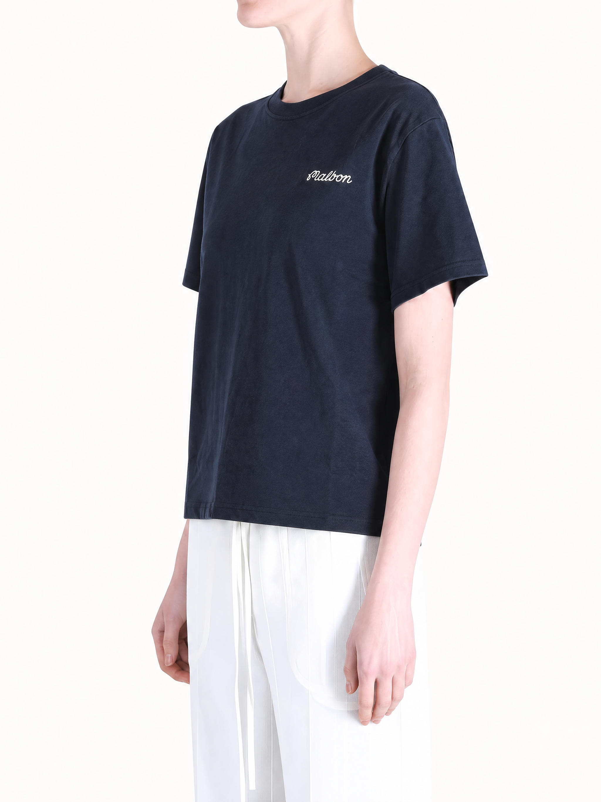 Navy t-shirt worn by a person, showing the t-shirt's fit.