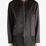 Brown jacket worn by a person, showing the jacket fit