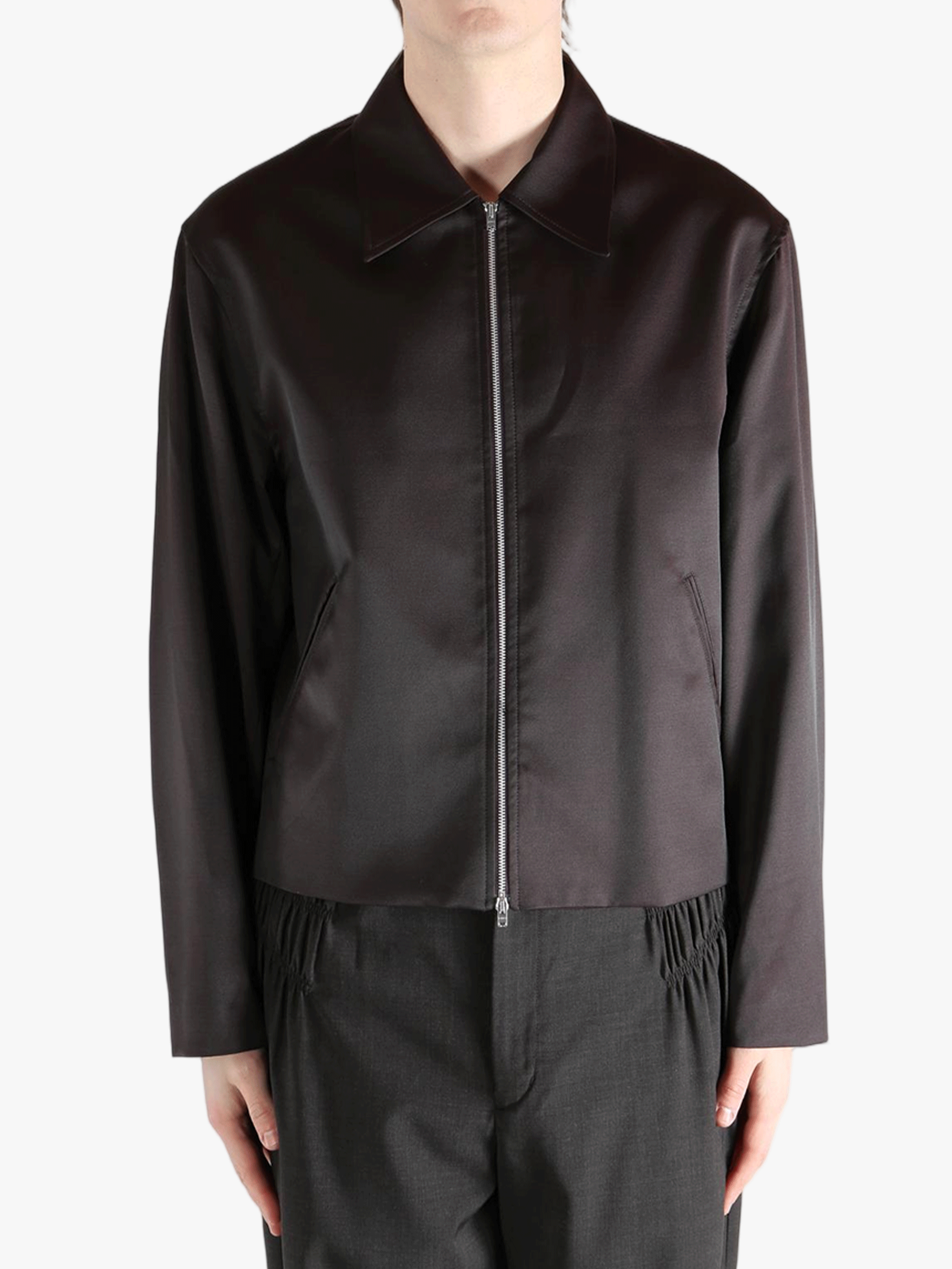 Brown jacket worn by a person, showing the jacket fit