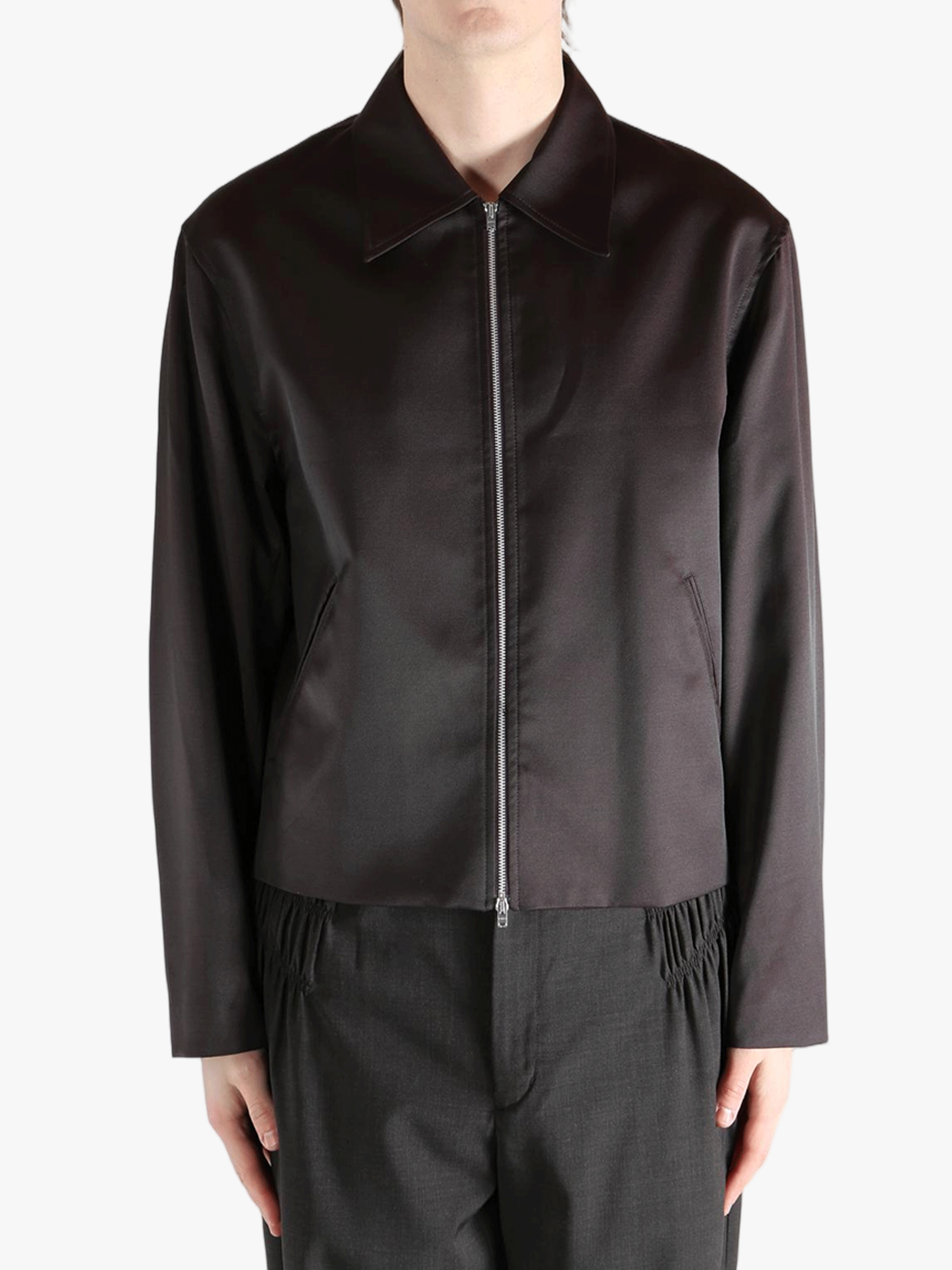 Brown jacket worn by a person, showing the jacket fit