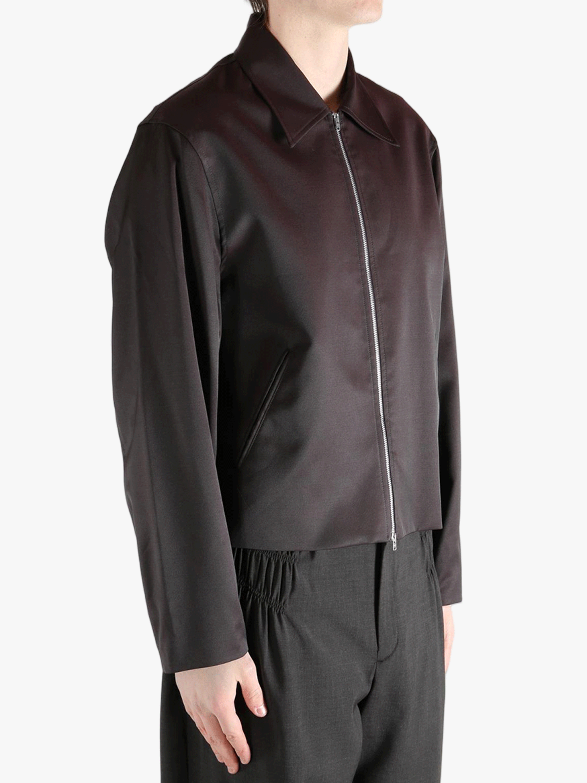 Brown jacket worn by a person, showing the jacket fit