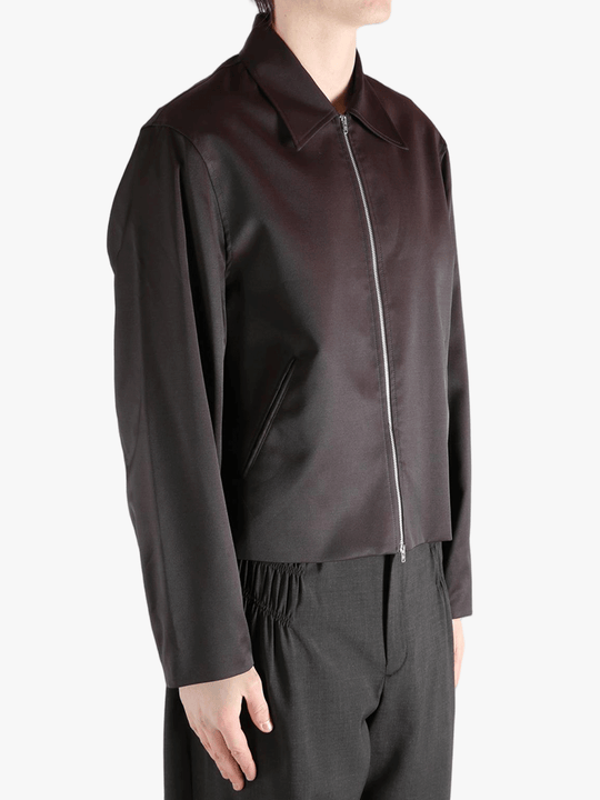 Brown jacket worn by a person, showing the jacket fit