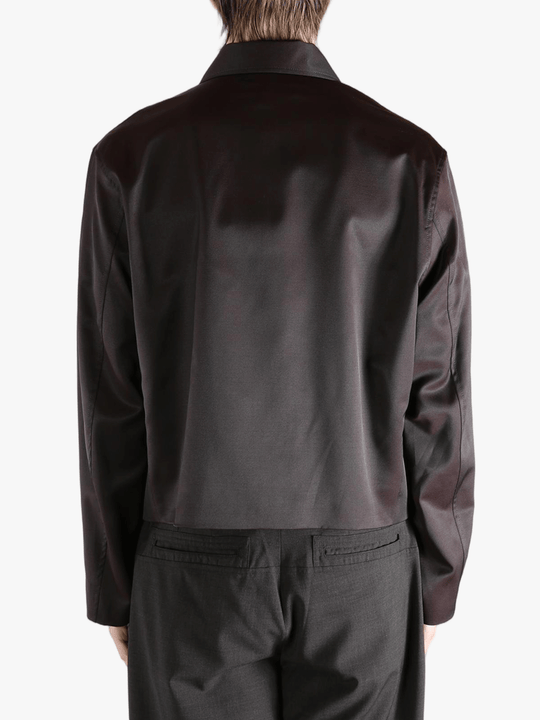 Brown jacket worn by a person, showing the jacket fit