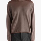 Brown knitwear worn by a person, showing the knitwear fit