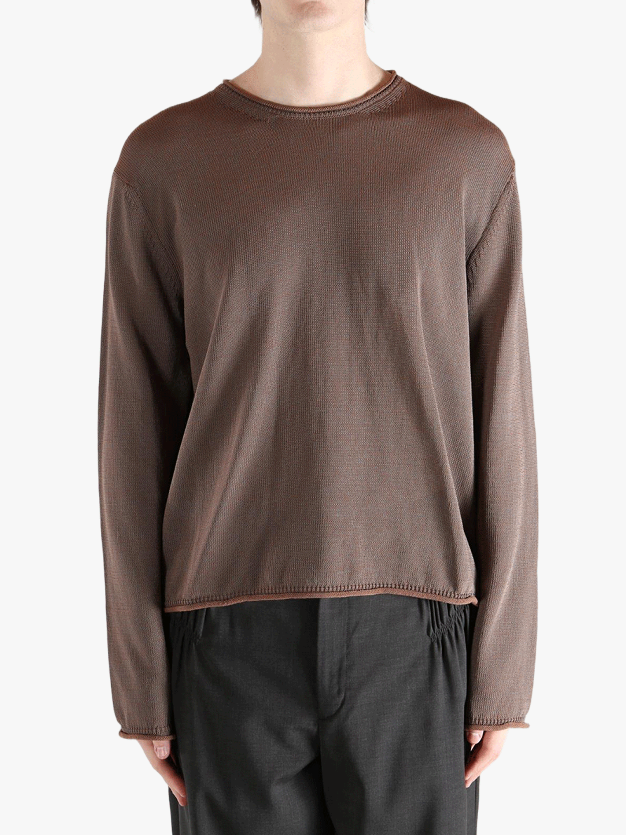 Brown knitwear worn by a person, showing the knitwear fit