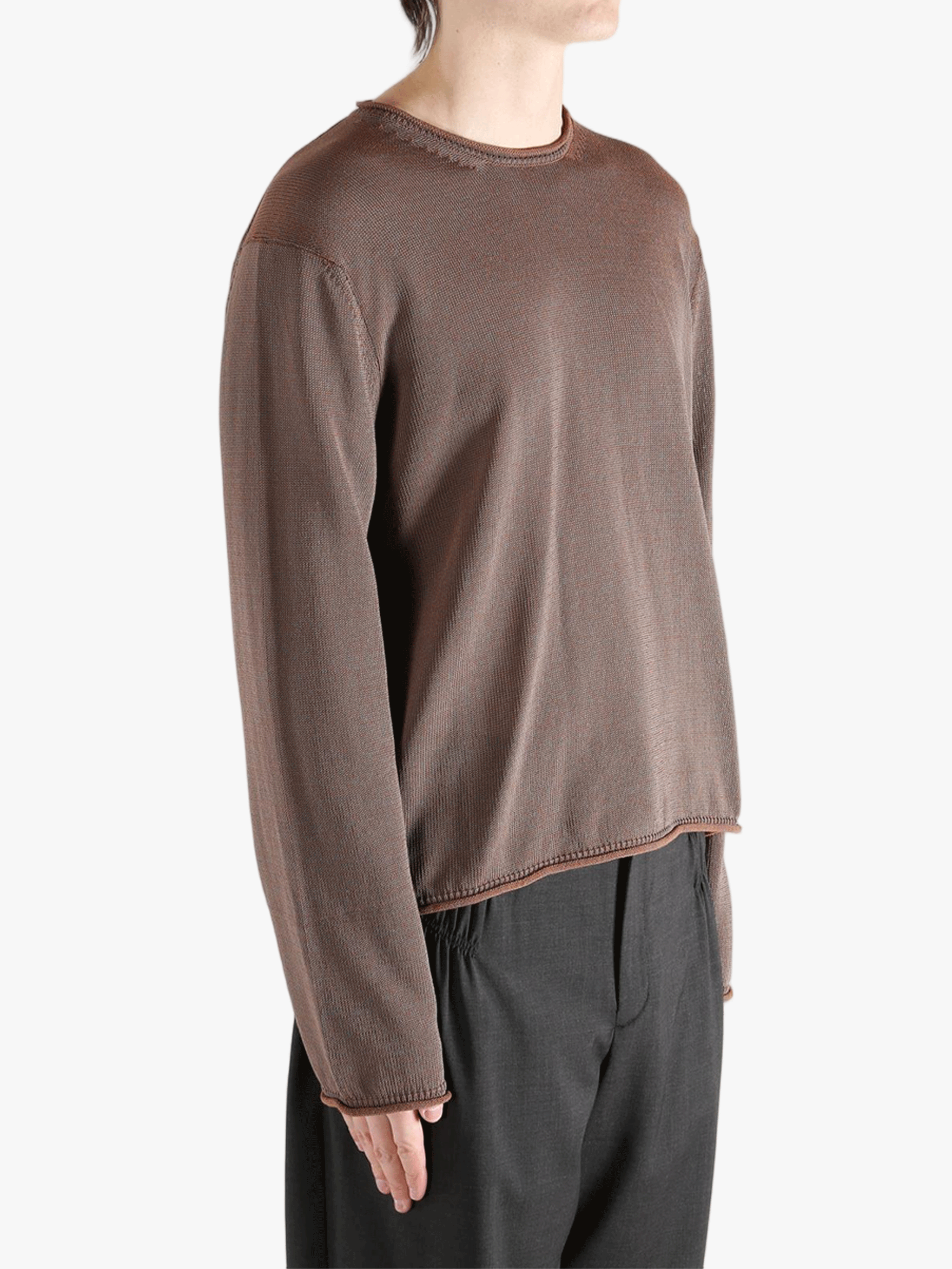 Brown knitwear worn by a person, showing the knitwear fit