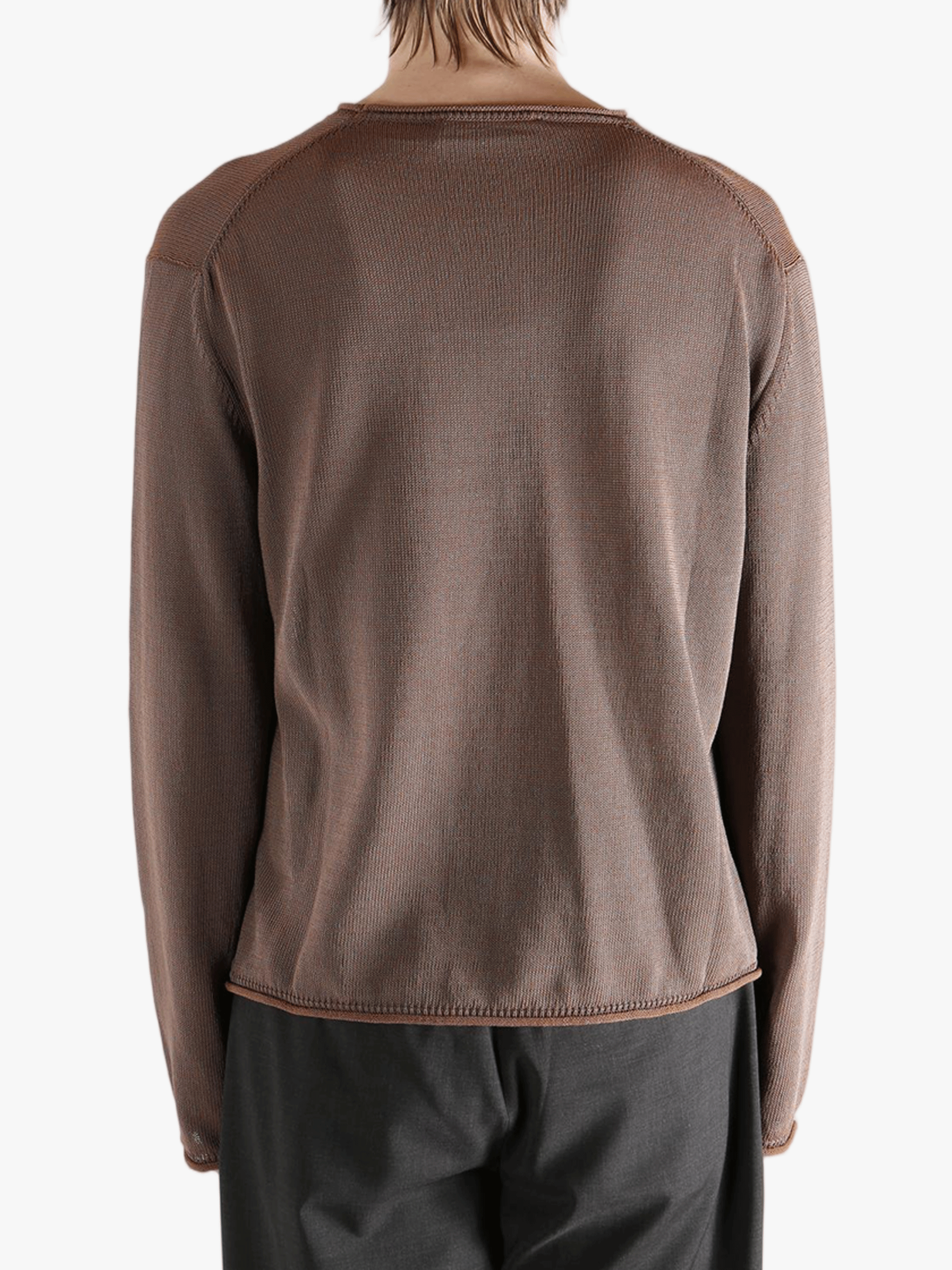 Brown knitwear worn by a person, showing the knitwear fit