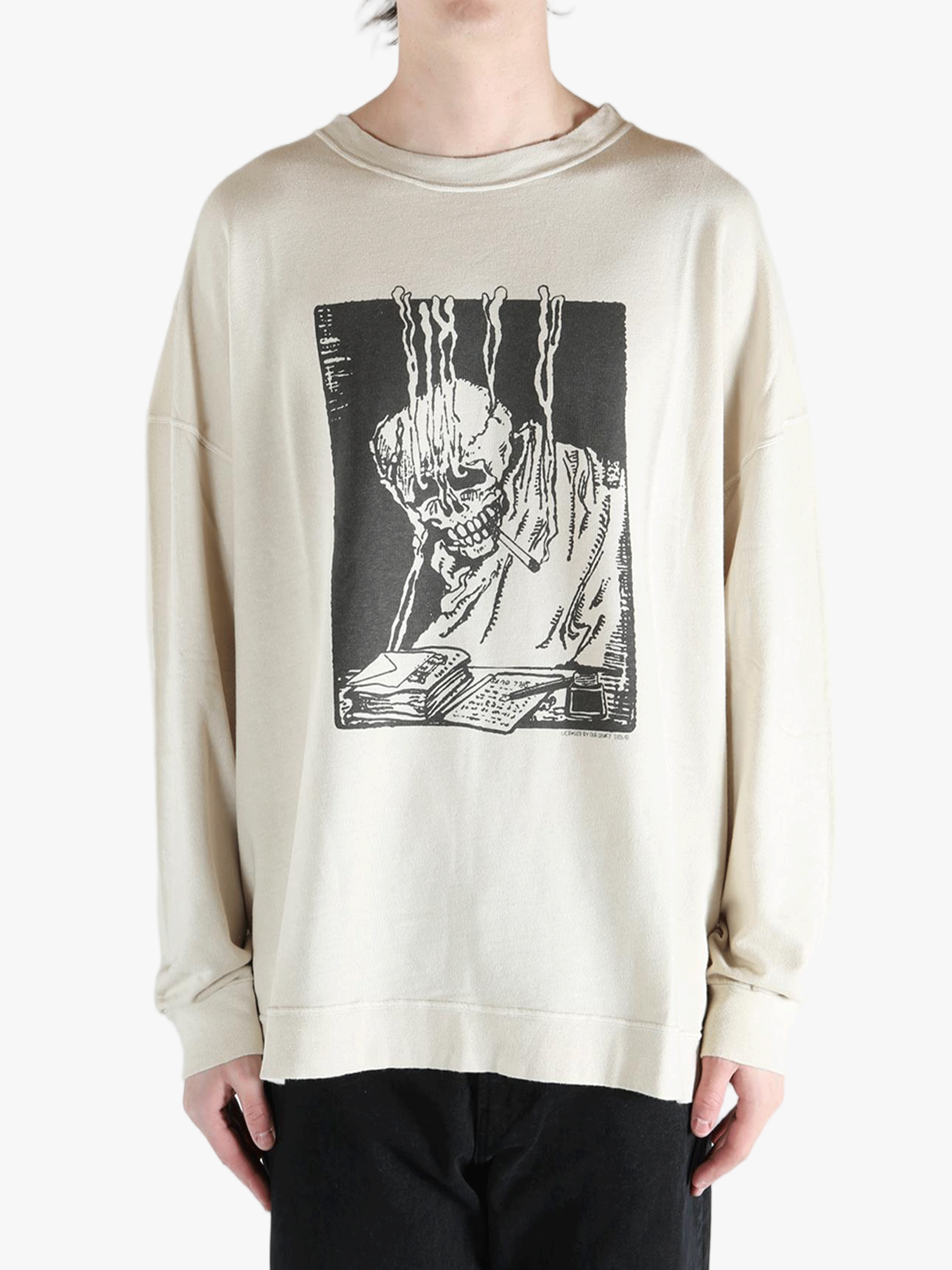 White sweatshirt worn by a person, showing the sweatshirt's fit