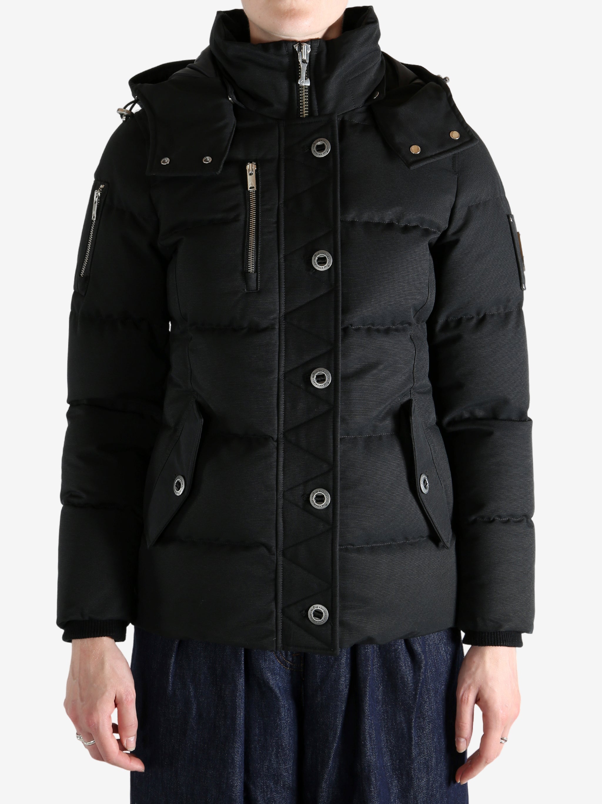 Black jacket worn by a person, showing the jacket's fit