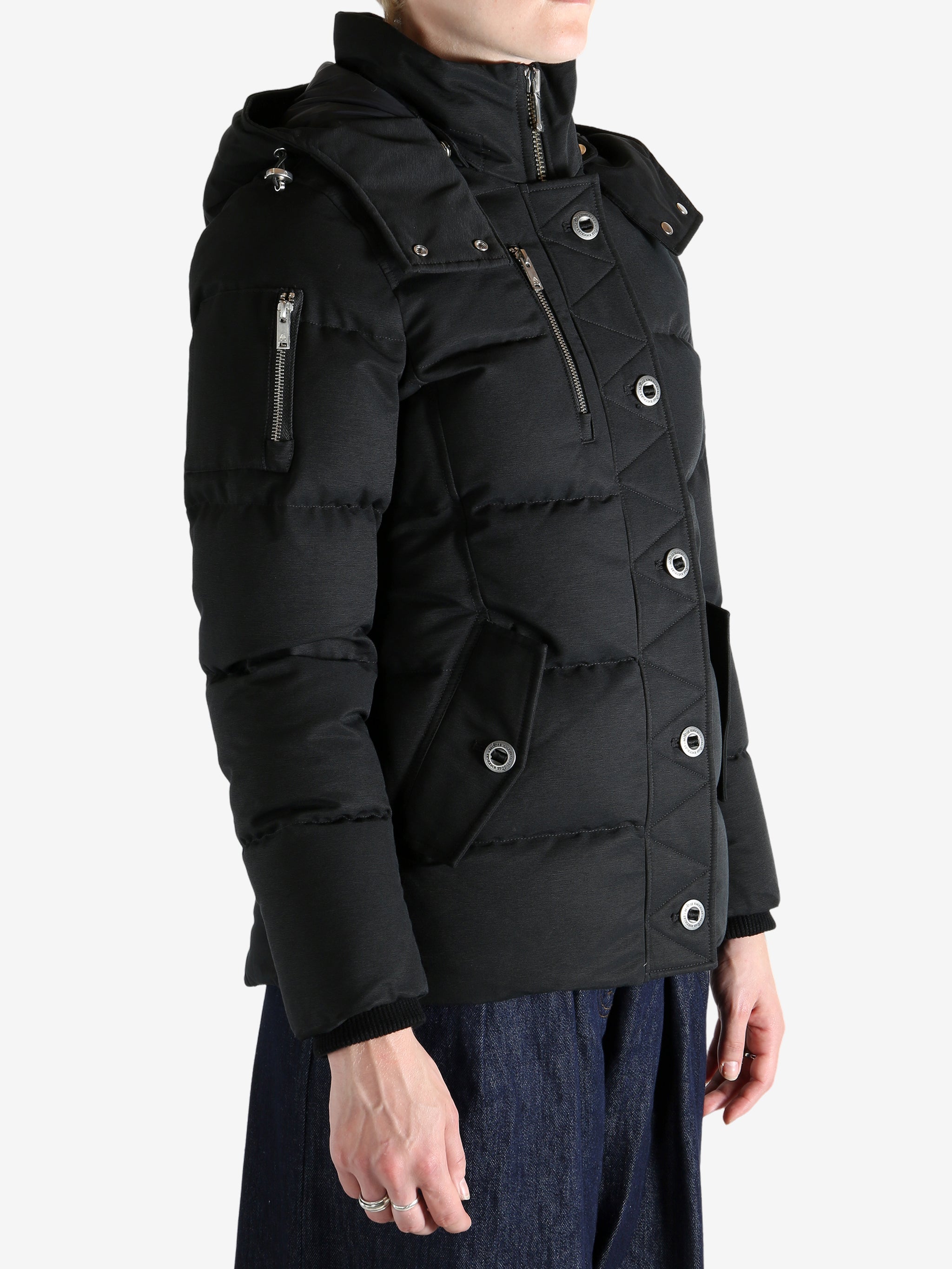 Black jacket worn by a person, showing the jacket's fit