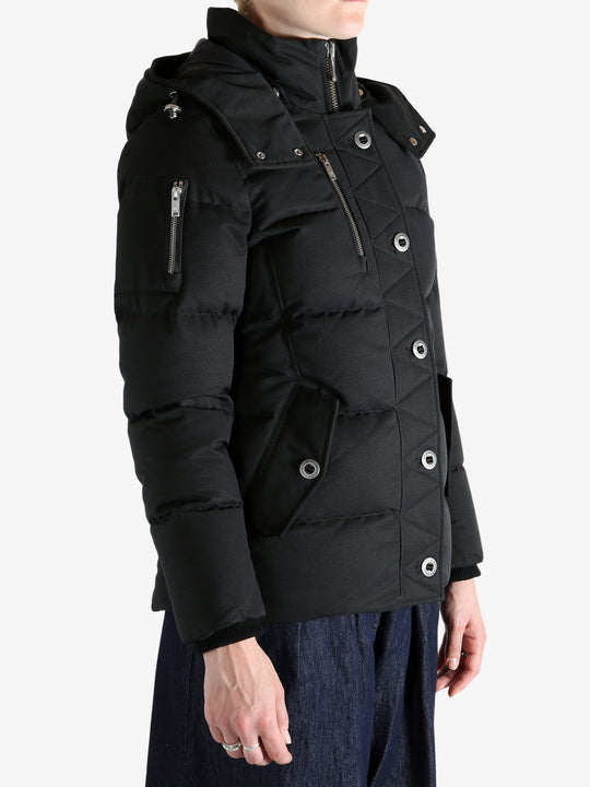 Black jacket worn by a person, showing the jacket's fit