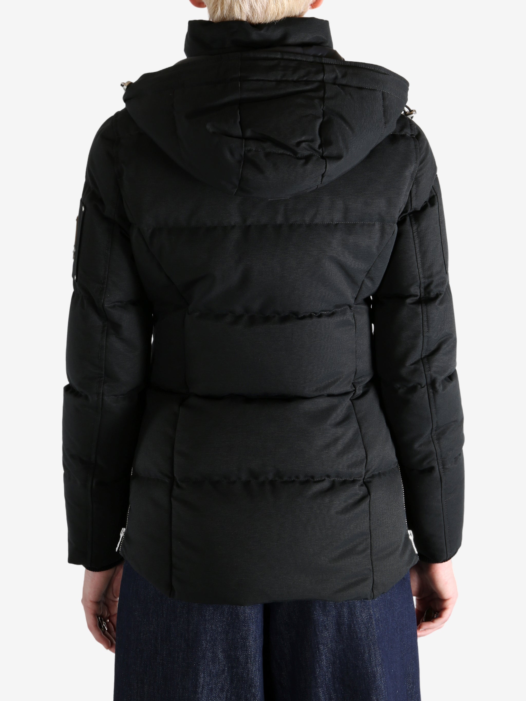 Black jacket worn by a person, showing the jacket's fit