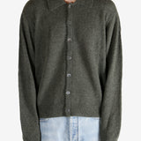 Green tops worn by a person, showing the tops fit