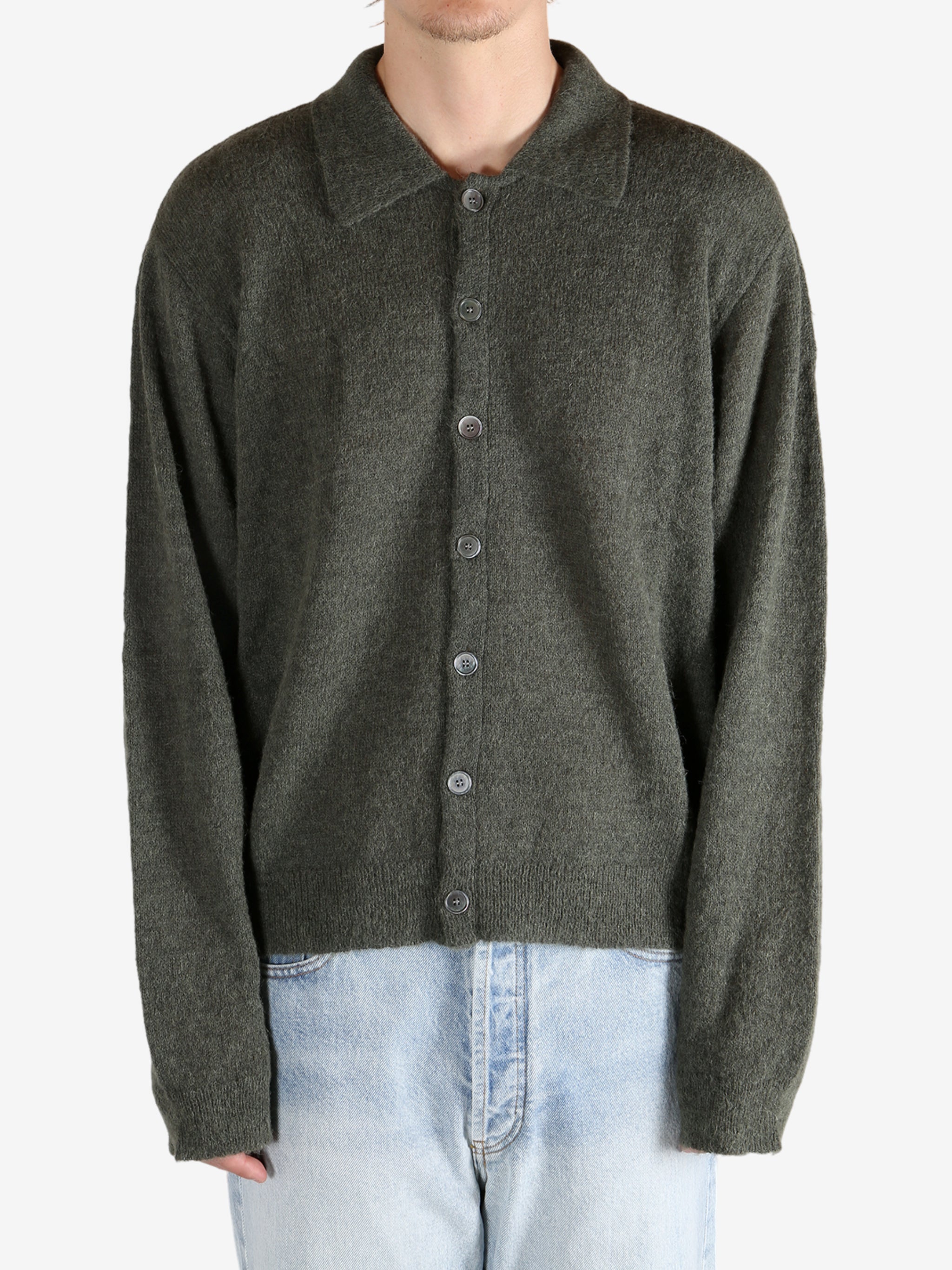 Green tops worn by a person, showing the tops fit