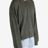 Green tops worn by a person, showing the tops fit