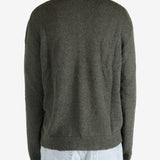 Green tops worn by a person, showing the tops fit