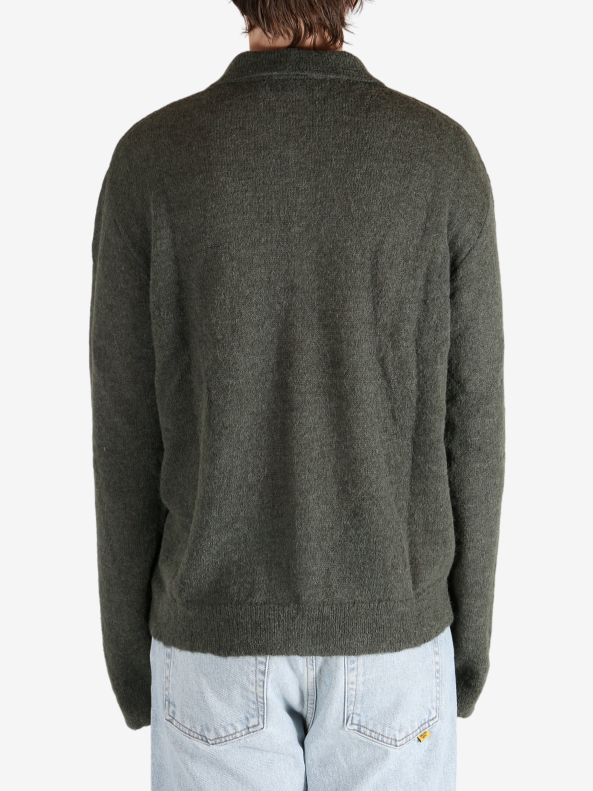 Green tops worn by a person, showing the tops fit