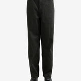 Black pants worn by a person, showing the pants's fit