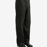 Black pants worn by a person, showing the pants's fit