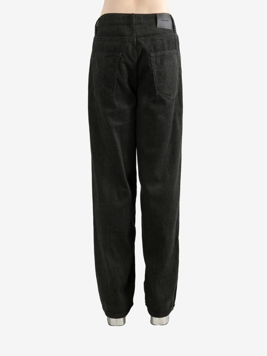 Black pants worn by a person, showing the pants's fit