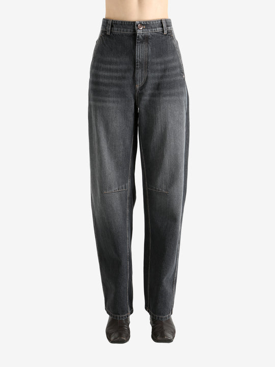 Black pants worn by a person, showing the pants' fit