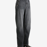 Black pants worn by a person, showing the pants' fit