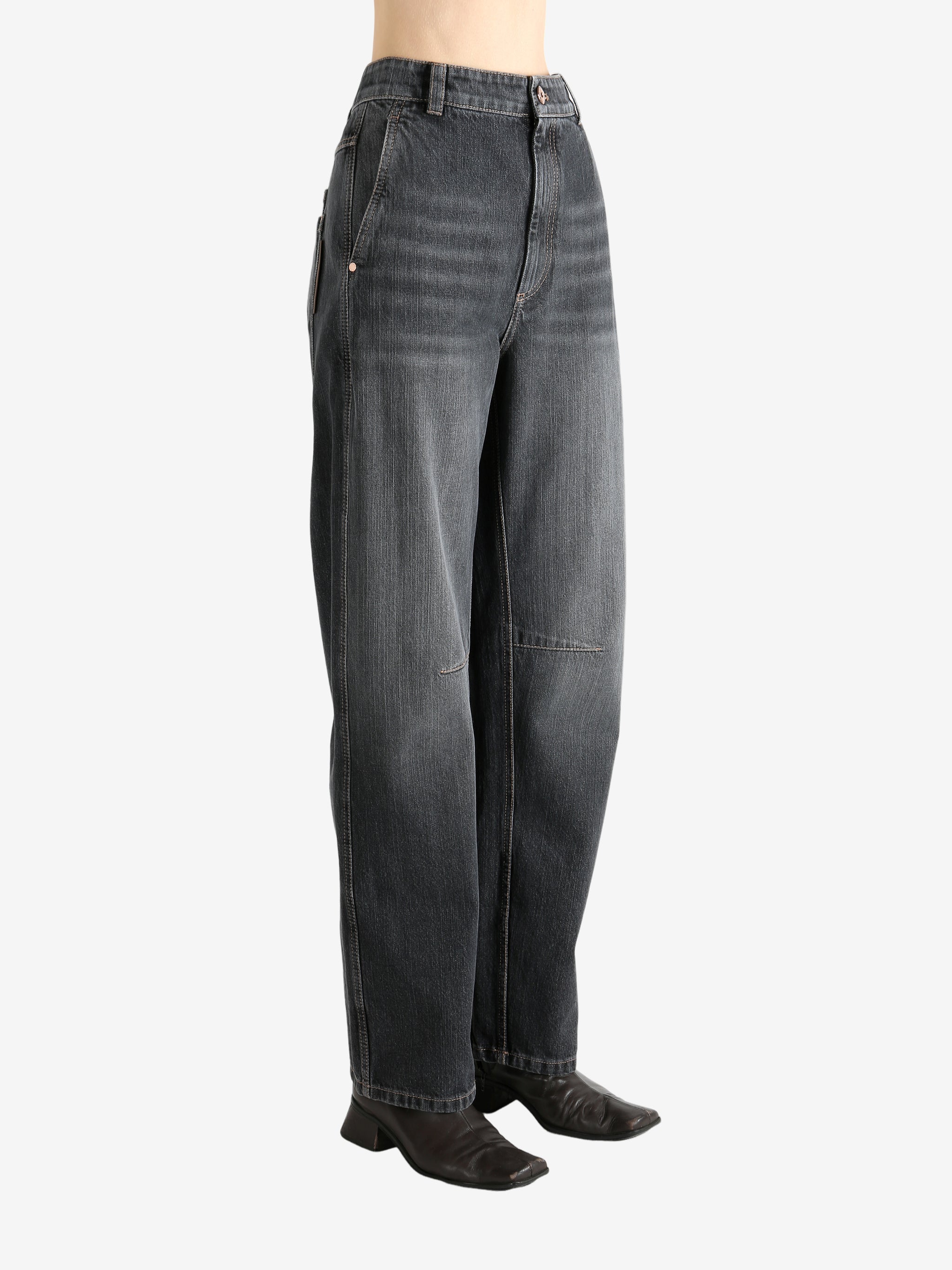 Black pants worn by a person, showing the pants' fit