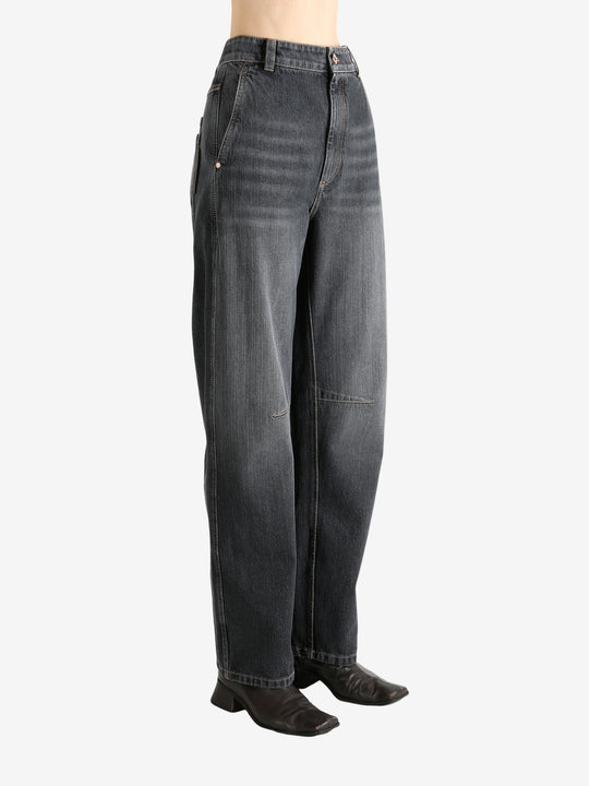 Black pants worn by a person, showing the pants' fit