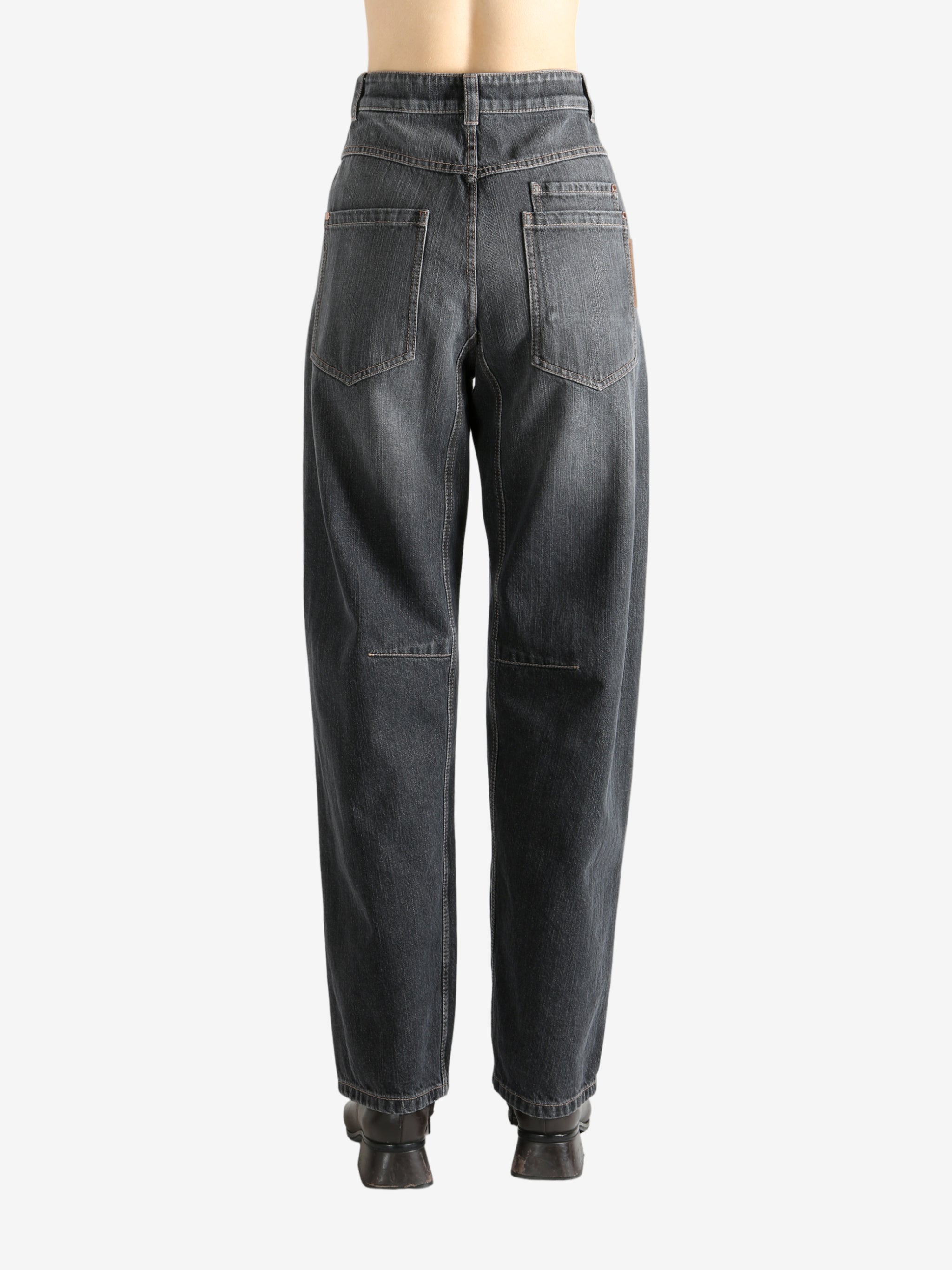 Black pants worn by a person, showing the pants' fit