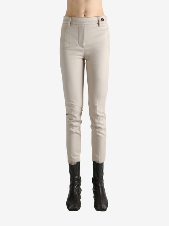 Tan pants worn by a person, showing the pants' fit