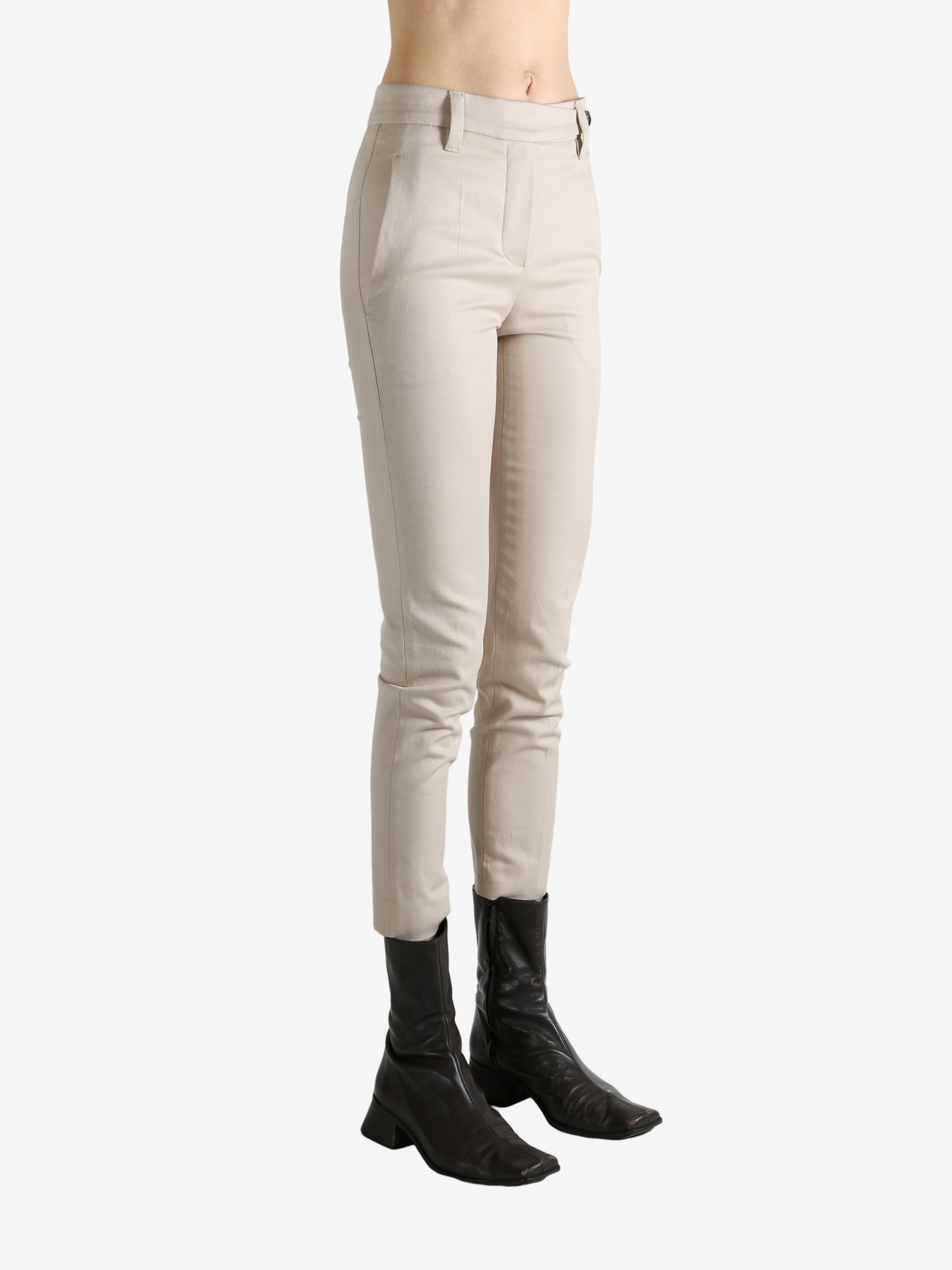 Tan pants worn by a person, showing the pants' fit