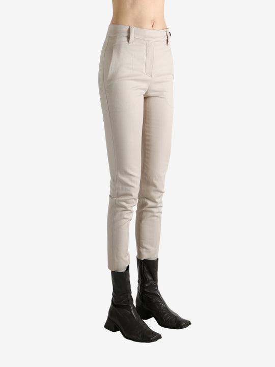 Tan pants worn by a person, showing the pants' fit