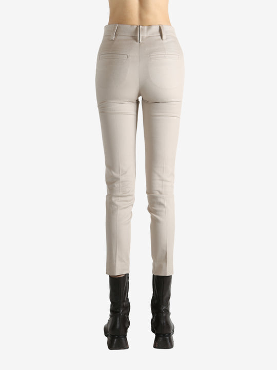 Tan pants worn by a person, showing the pants' fit
