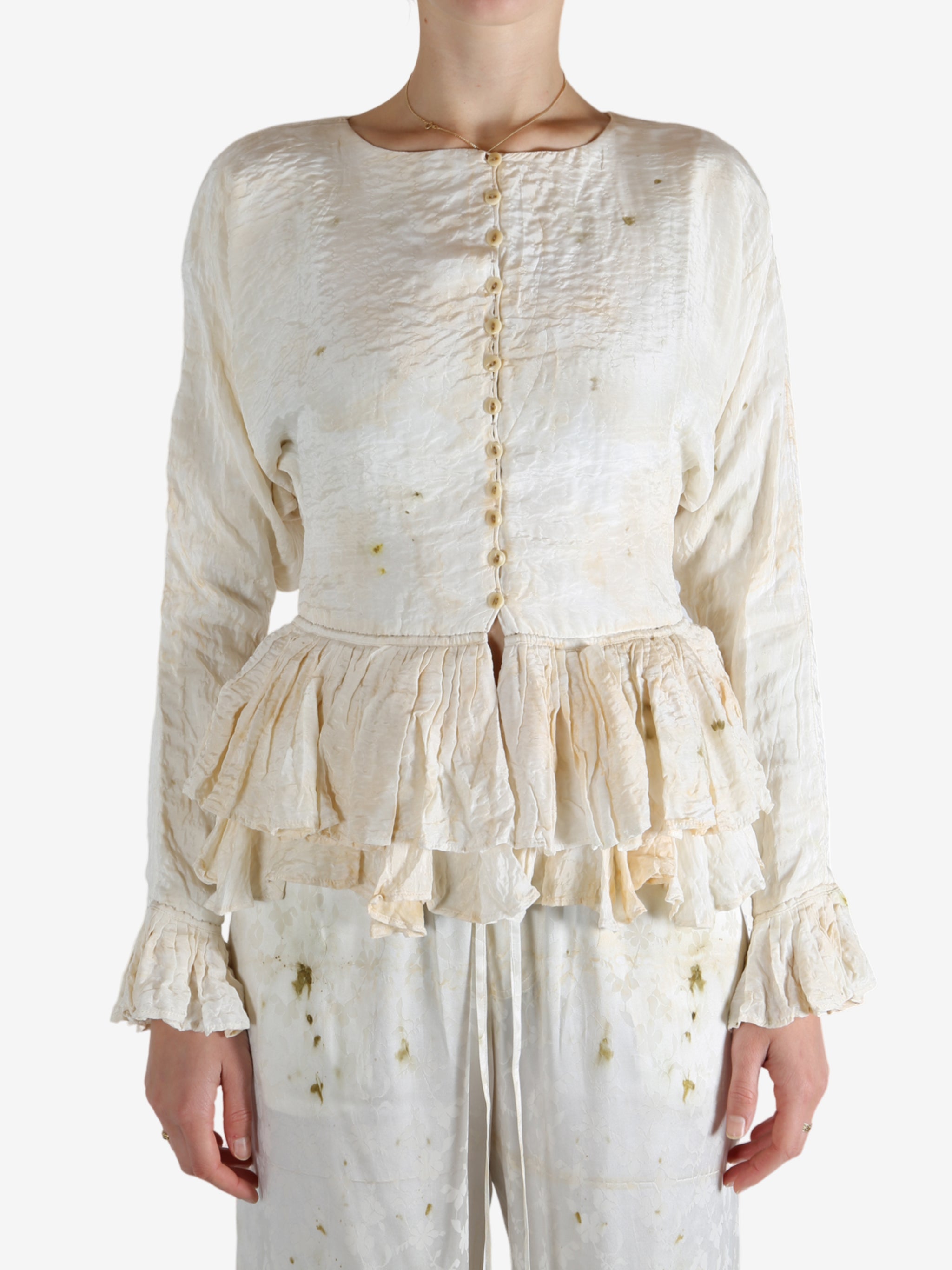 White tops worn by a person, showing the tops's fit