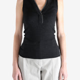 Black top worn by a person, showing the top's fit