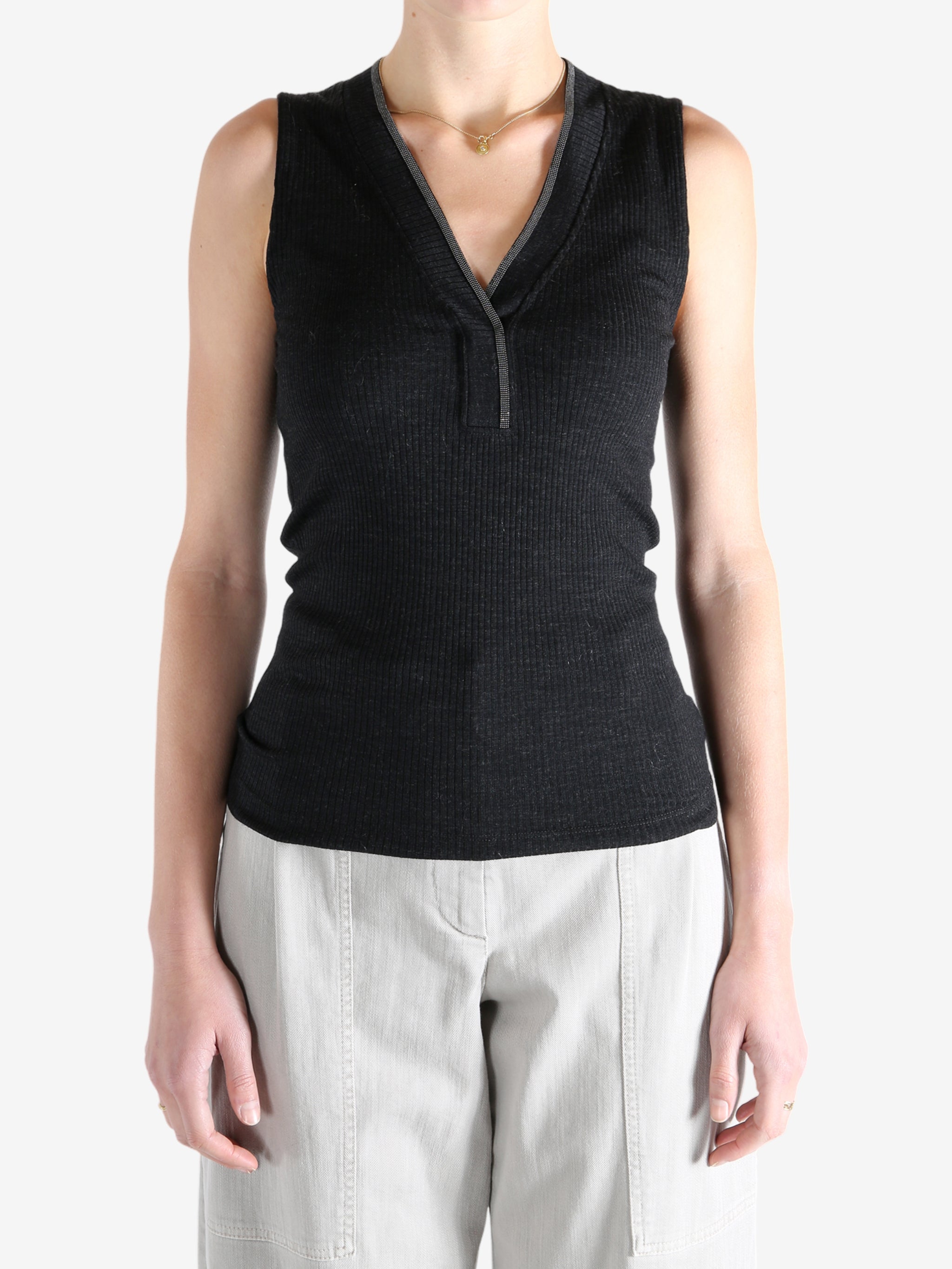 Black top worn by a person, showing the top's fit