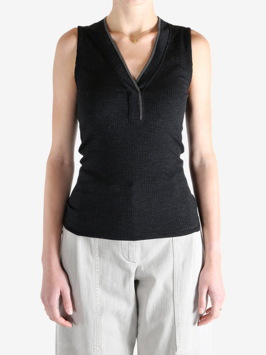 Black top worn by a person, showing the top's fit