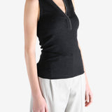 Black top worn by a person, showing the top's fit