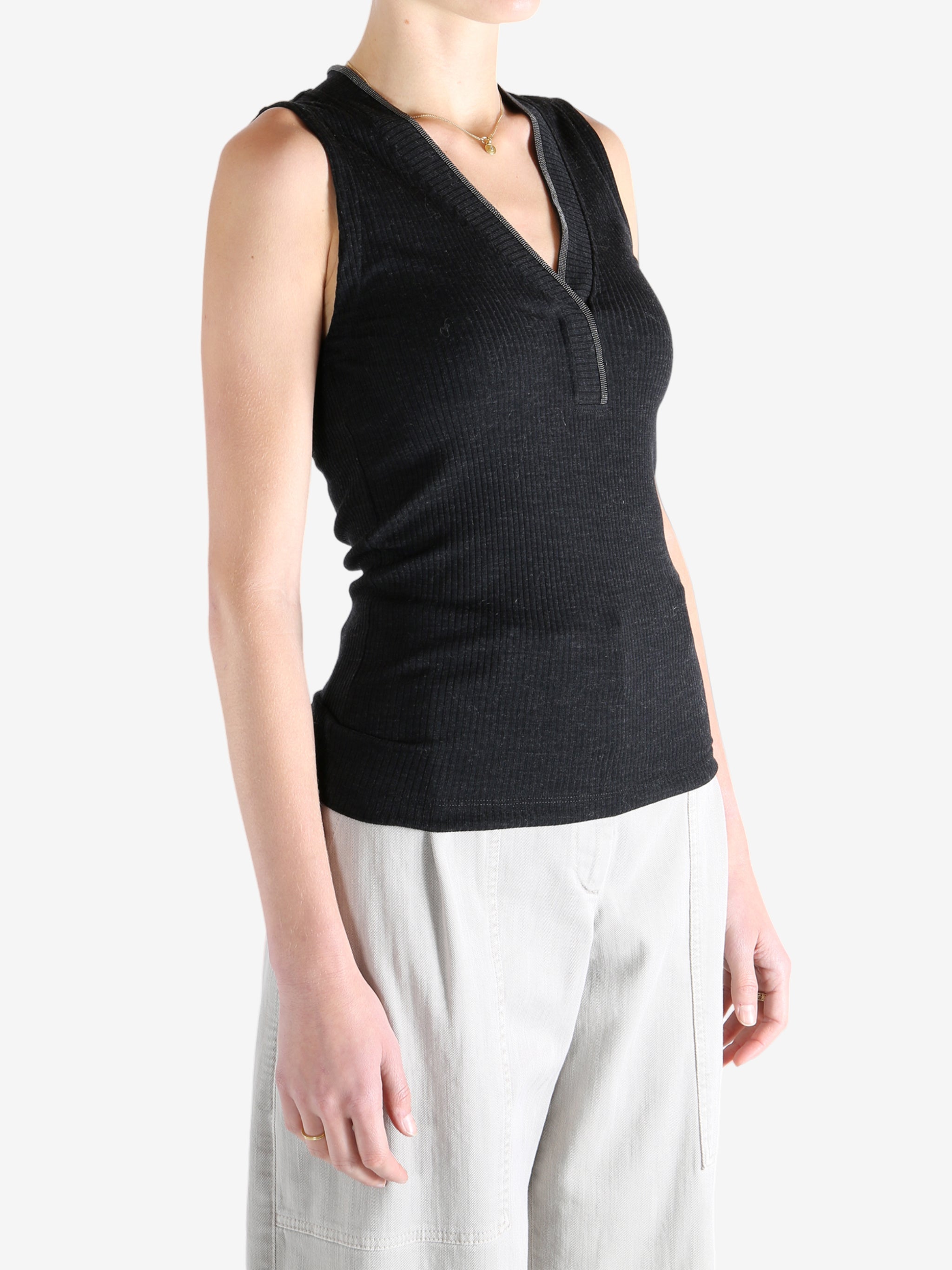 Black top worn by a person, showing the top's fit